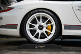 Side profile of a Porsche GT3rs resting on ALTairEGO tyre cushions